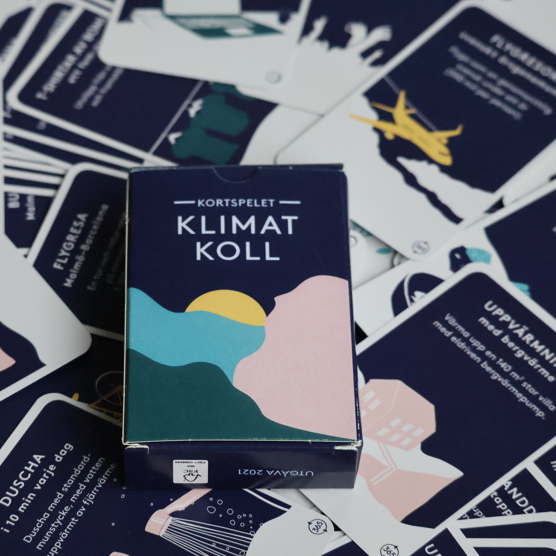 Klimatkoll spelask med kort bakom